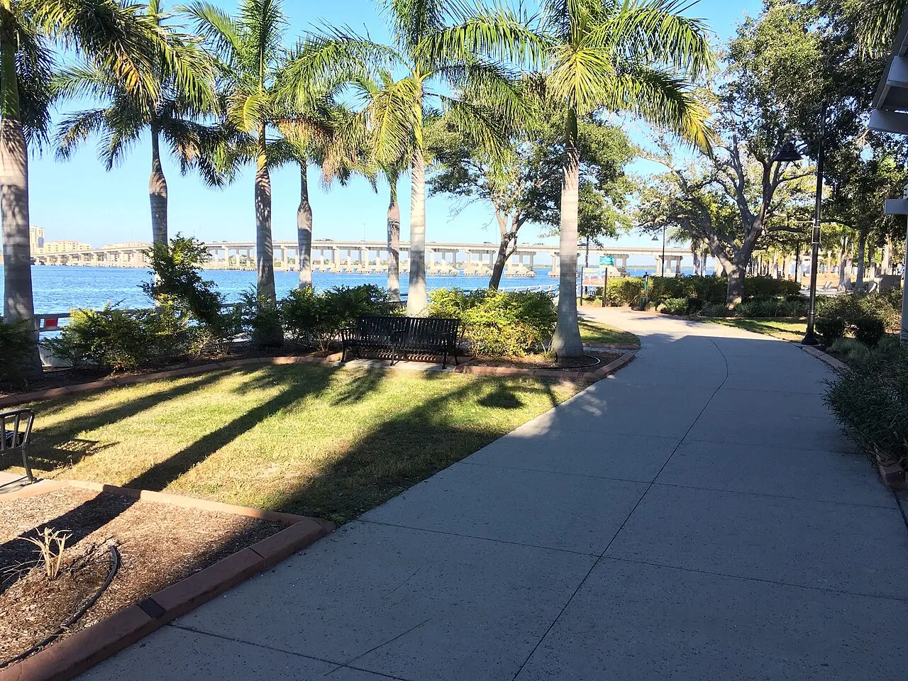 Palm-lined Bradenton Riverwalk beside the Manatee River