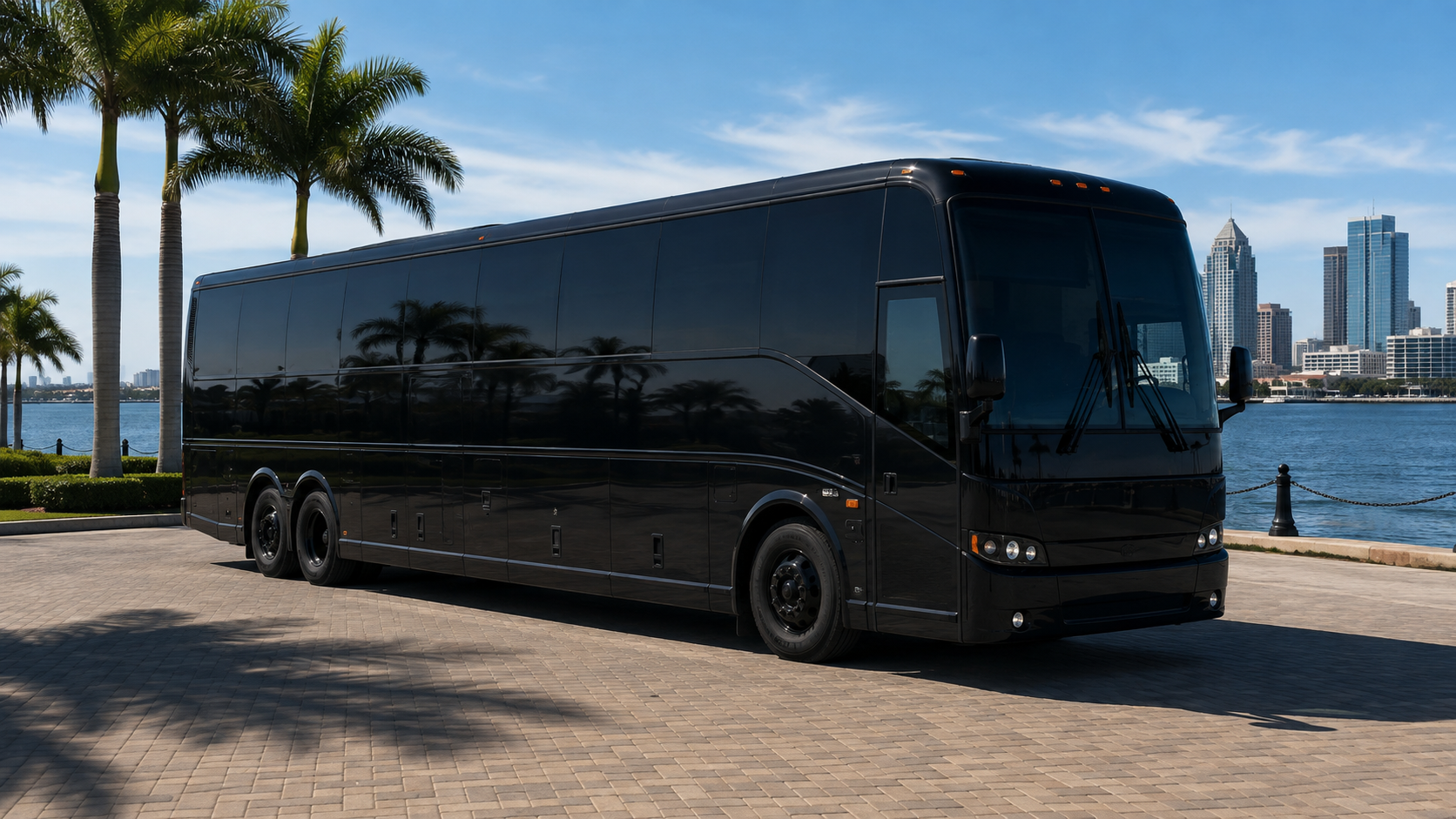 Modern black-on-black full-size motor coach for large group transportation in Florida